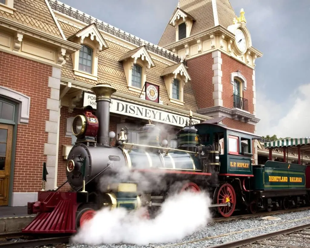 Photo of the Disneyland Railroad, With its turn-of-the-century architecture and lush gardens, the Main Street station offers the first point of entry for those who wish to soak up the scenery on a grand circuit tour of Disneyland park aboard one of the trains of the Disneyland #disney #disneyland #disneylandrailroad
