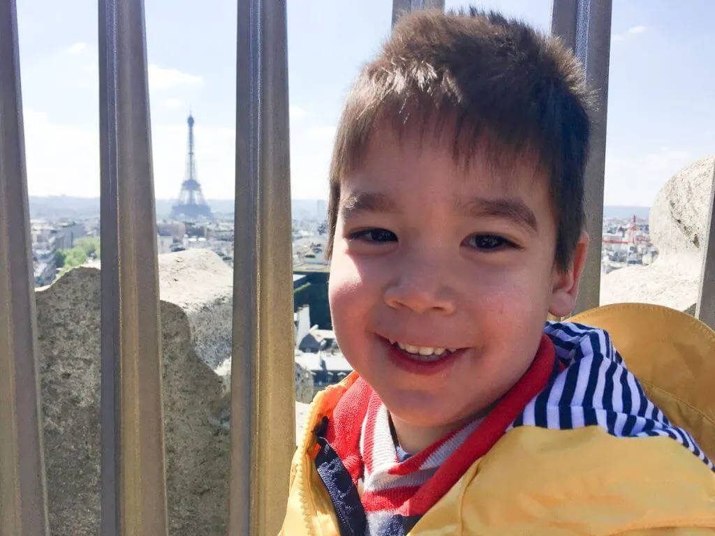 Photo of the Eiffel Tower from the top of the Arc de Triomphe on a Paris family vacation with kids #eiffeltower #arcdetriomphe #pariswithkids #familytravel