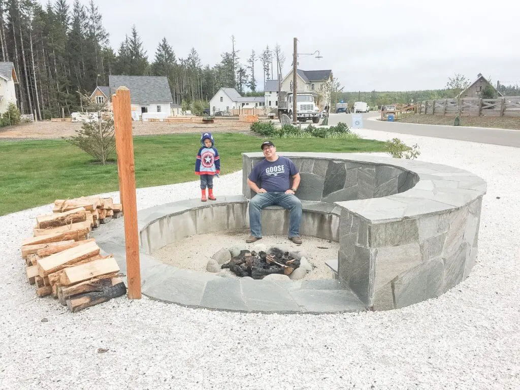 Photo of a large outdoor fire pit where families can roast marshmallows, which is one of the fun things to do in Seabrook, Washington with kids #firepit #seabrook #seabrookwa #pnw #washingtonstate #washingtoncoast
