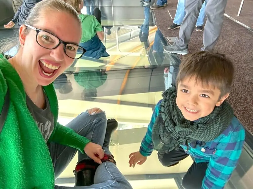 Image of a mom and son on the Space Needle revolving glass floor.