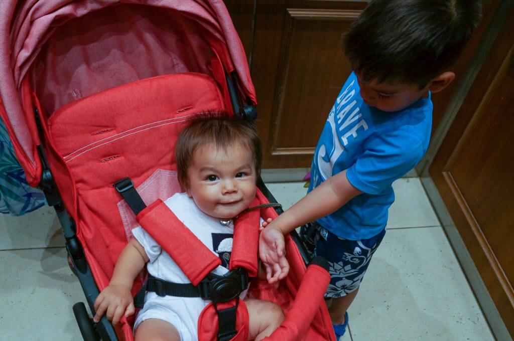 My oldest loved to play with his brother in the lightweight stroller because he was at a good height. Photo credit: Darren Cheung