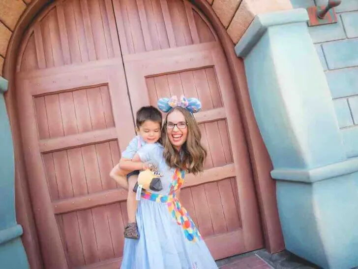 Check out these tips for visiting Disneyland with a 3 year old by top Disney blog Marcie in Mommyland. Image of a mom giving a piggyback ride to her son at Toontown in Disneyland