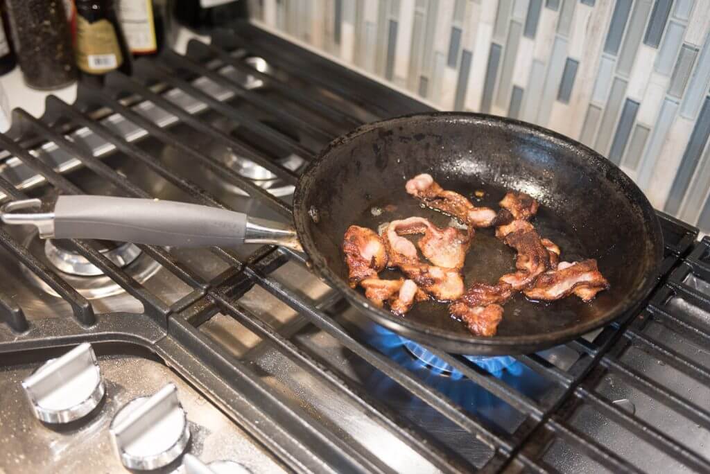 Cook bacon and drain fat.