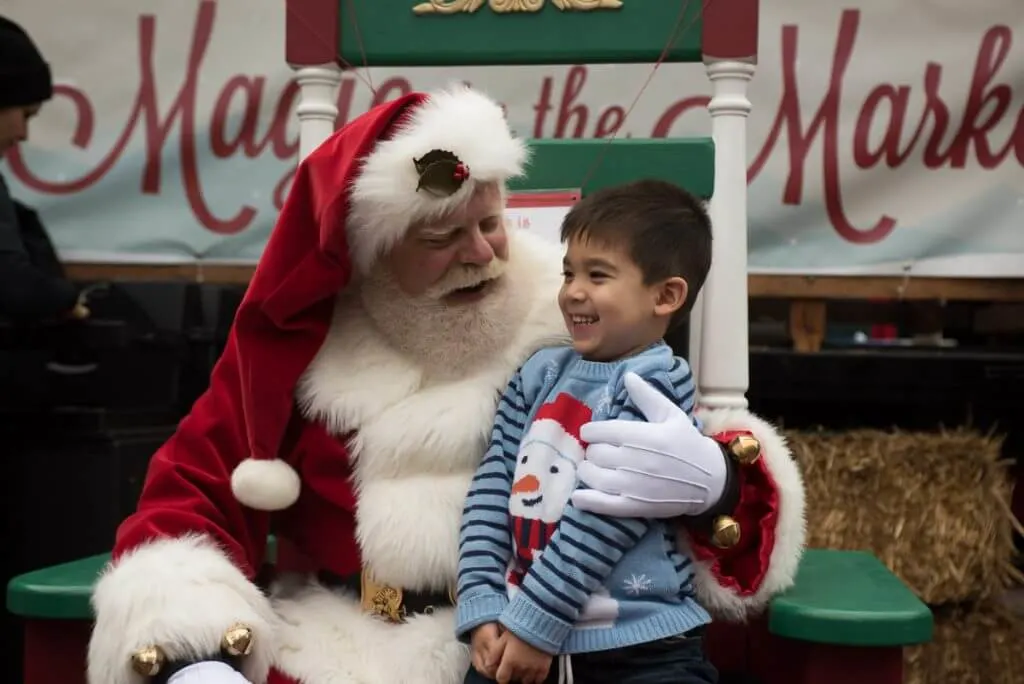 Visiting Santa Trever at Magic in the Market is one of our favorite Seattle Christmas activities! Photo credit: Darren Cheung