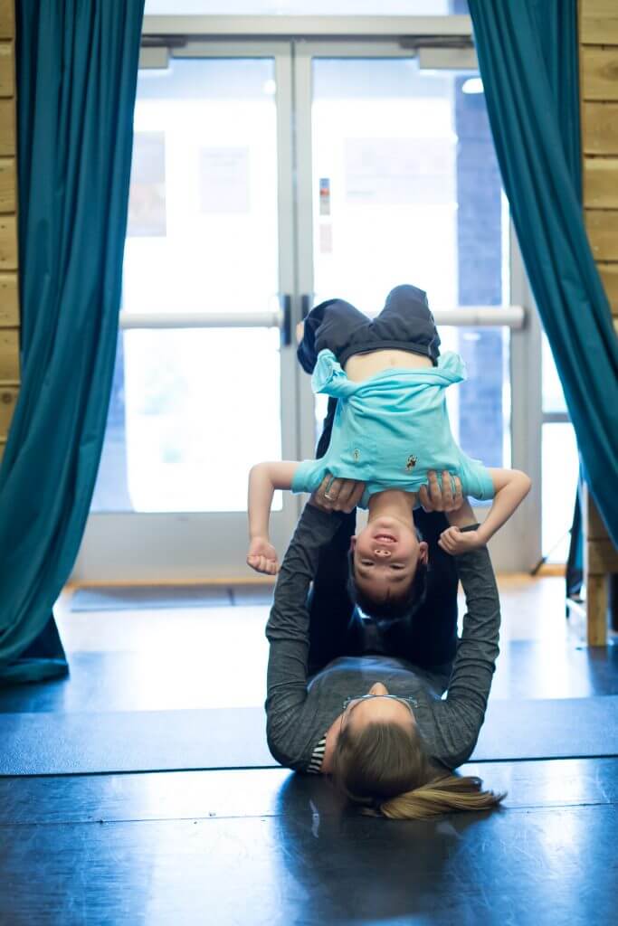 Safety is a priority when doing partner yoga with kids of any age.