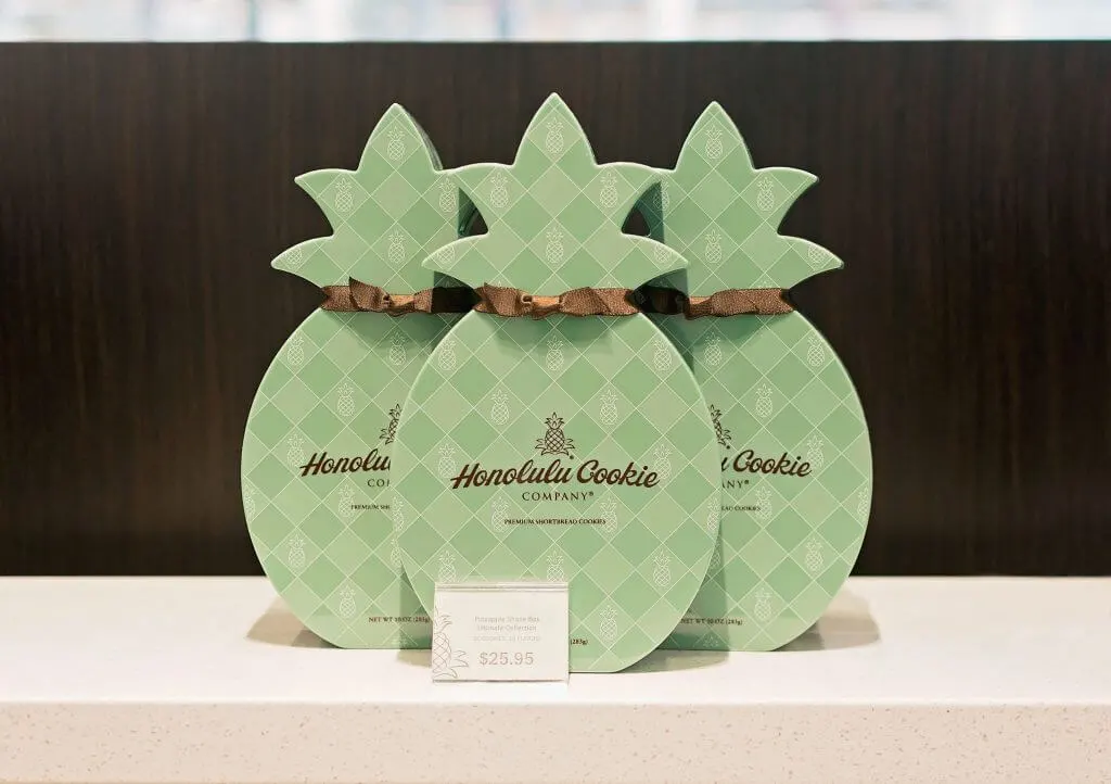 Photo of Honolulu Cookie Company pineapple shaped gift boxes of Hawaiian cookies.