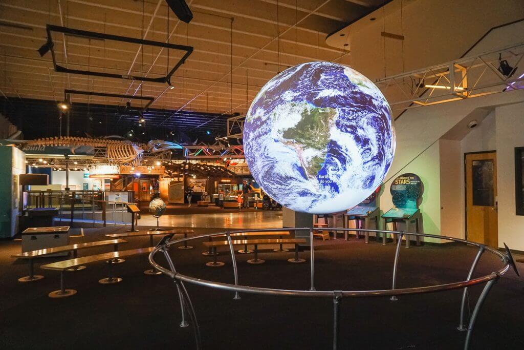 Photo of the Pacific Science Center at Seattle Center, which is a great family activity in Seattle for kids #seattle #seattlewa #pacsci #pacificsciencecenter #seattlecenter