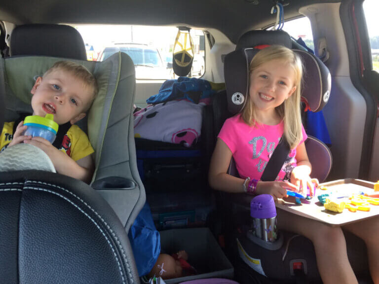 Photo of kids on a family road trip during summer travel #roadtrip #familytravel #traveltips #roadtriptips #nationalchildrenscancersociety