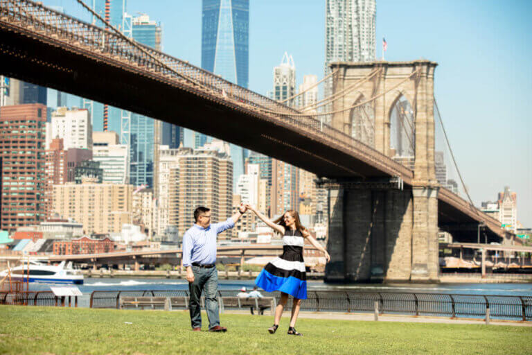 Photo in front of the Brooklyn Bridge in New York City, which is a top attraction in NYC. Photo is by Armondo from Flytographer. #nyc #newyorkcity #brooklynbridge #flytographer