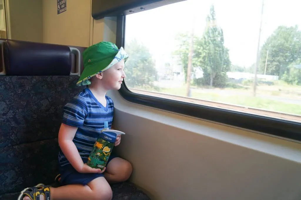 Photo of a kid on the Sounder train to Seattle, WA from Kent Station in Kent, WA #soundtransit #sounder #kentstation #boeingfield #tukilwa #seattlewa #visitseattle