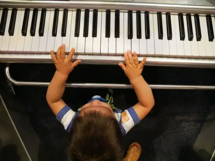 Photo of a toddler playing piano at the Sound Lab at the Seattle Museum of Pop Culture. #mopopculture #seattlecenter #music #soundlab #visitseattle