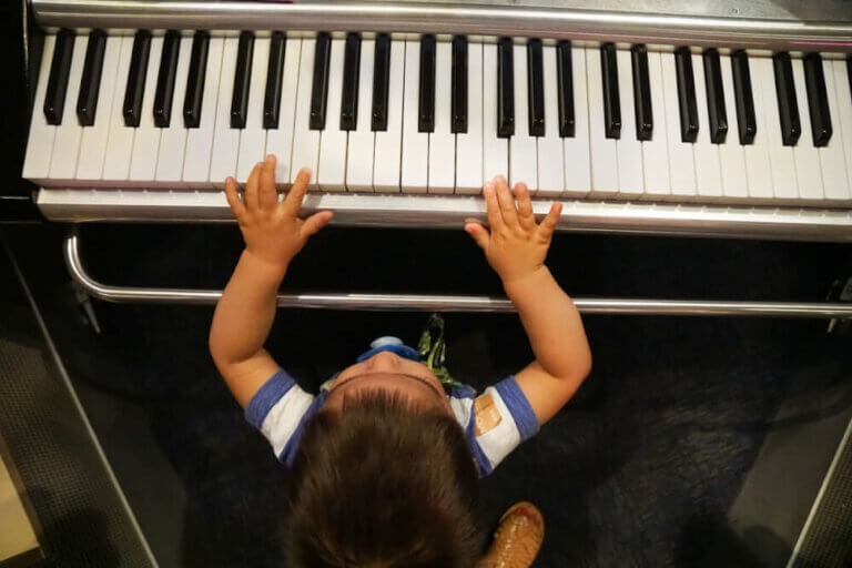 Photo of a toddler playing piano at the Sound Lab at the Seattle Museum of Pop Culture. #mopopculture #seattlecenter #music #soundlab #visitseattle