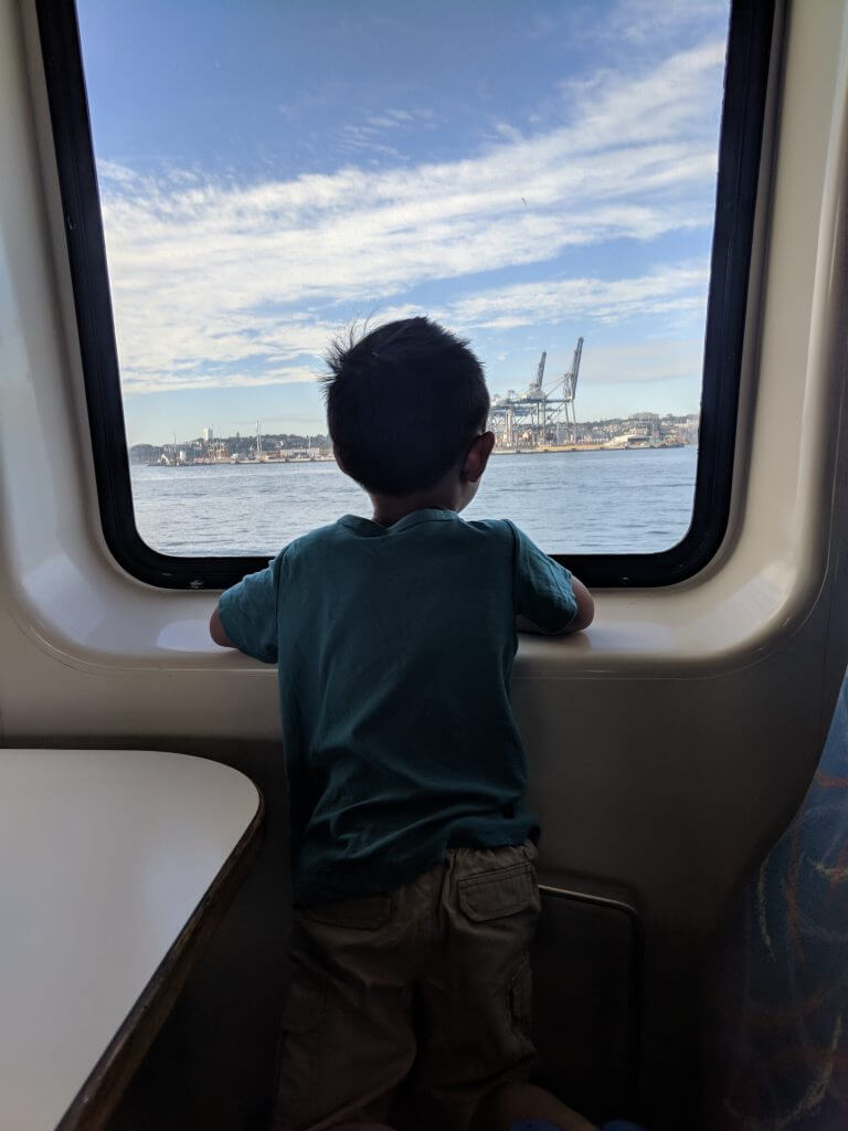 Photo of a boy riding the ferry to Devonport during a New Zealand family vacation. #newzealand #devonport #ferry #nz #auckland