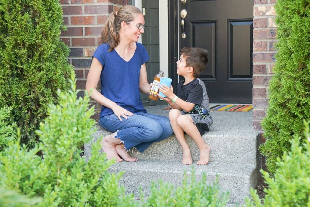 Photo of a mom drinking Honest Tea while sitting on the front porch #honesttea