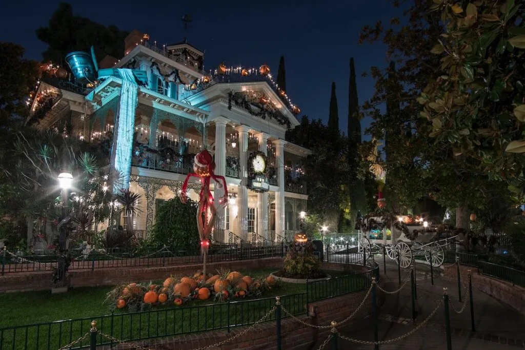 Haunted Mansion Holiday at the Disneyland Resort 
From Sept. 1–Oct. 31, 2023, Haunted Mansion Holiday during Halloween Time at Disneyland Park features a merry makeover of the beloved eerie estate. Jack Skellington is behind the mayhem, decorating the mansion with frightfully festive touches inspired by “Tim Burton’s The Nightmare Before Christmas.” Dedicated fans of the holiday house will look forward to spotting the annual bespoke gingerbread house on its precarious perch on the ballroom table. Other favorite sights await, including characters from the movie Sally, Zero and other Nightmare nasties on hand. (Disneyland Resort)
