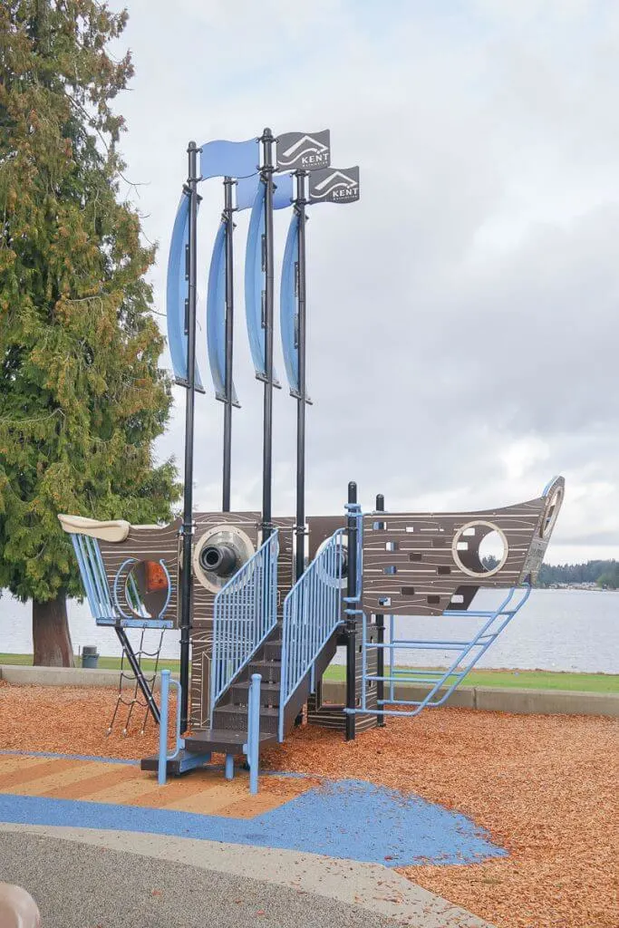 Photo of a pirate ship playground feature at Lake Meridian Park in Kent, WA #visitkentwa #lakemeridianpark #playground 