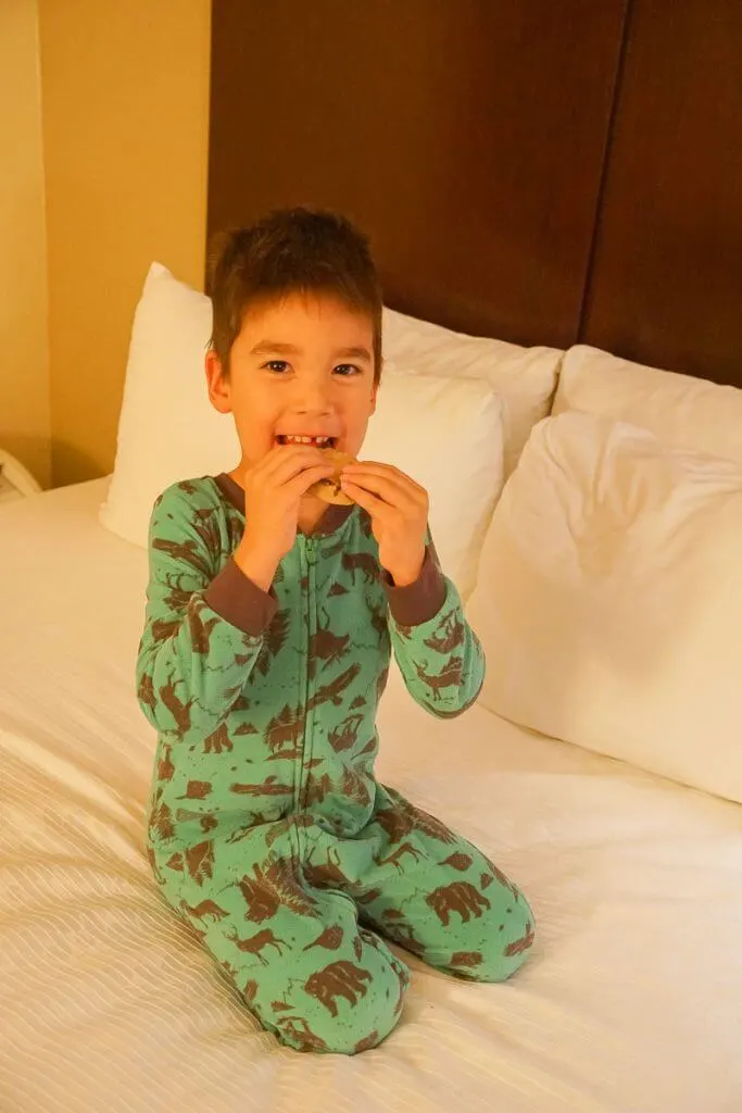 Photo of a boy eating a chocolate chip cookie at the Best Western in Kent, WA #visitkentwa #bestwestern
