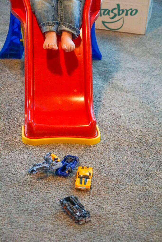 Photo of a boy playing with Transformers and his slide #transformers #bumblebeemovie #fredmeyerstores