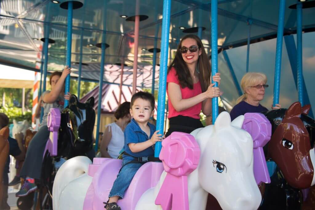 Photo of Mia's Riding Camp, a carousel at LEGOLAND California that's easy for toddlers #LEGOLANDCA #carousel #LEGOFriends