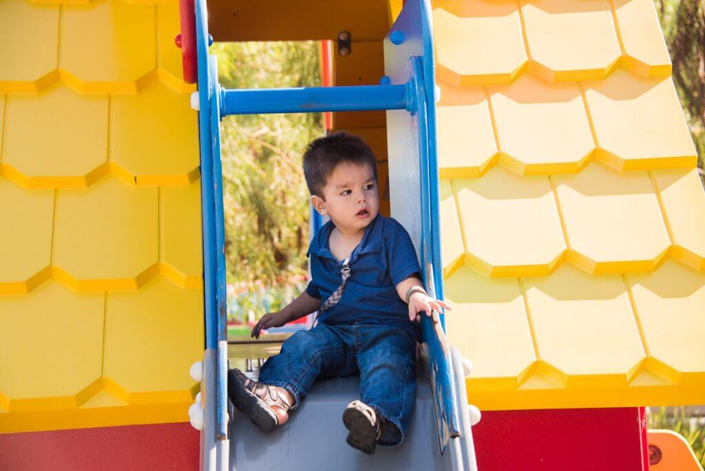 Photo of a toddler playing at DUPLO Playtown at LEGOLAND California, which is fun at LEGOLAND for toddlers #LEGOLANDCA #DUPLO #playground