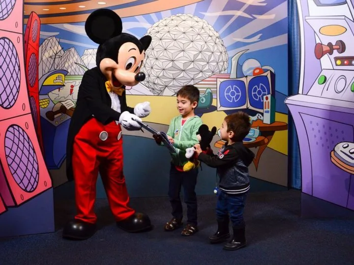 Mickey Mouse greets guests inside at the Epcot Character Spot at Walt Disney World in Orlando, Florida, which is definitely a must see attraction at Epcot with kids #epcot #mickeymouse #waltdisneyworld #disneyworld | Tips to spend one day at Epcot with Kids featured by top Disney blogger, Marcie in Mommyland