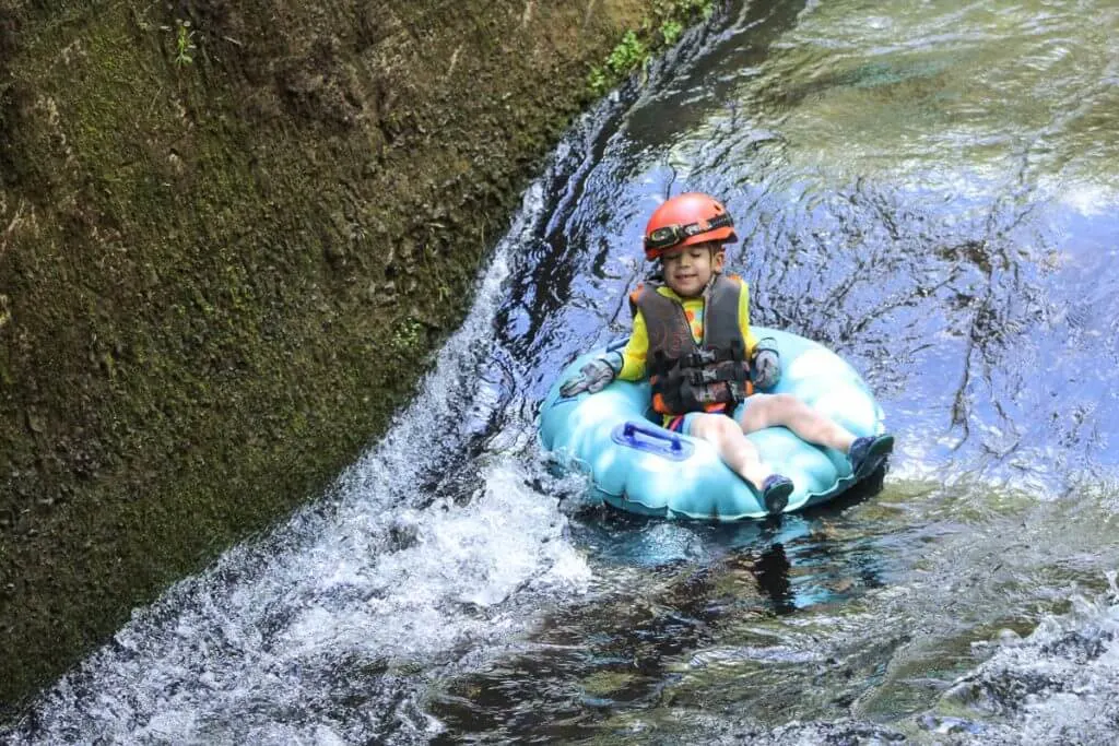 Top 20 Kid Friendly Travel Destinations for 2020 featured by top US family travel blogger, Marcie in Mommyland: Kauai Backcountry Adventures feature's the only mountain tubing adventure on Kauai and it's a fun, kid-friendly Kauai adventure! #kauai #tubing #hawaii | Kauai Mountain Tubing in Sugar Cane Canals featured by top US travel blogger, Marcie in Mommyland