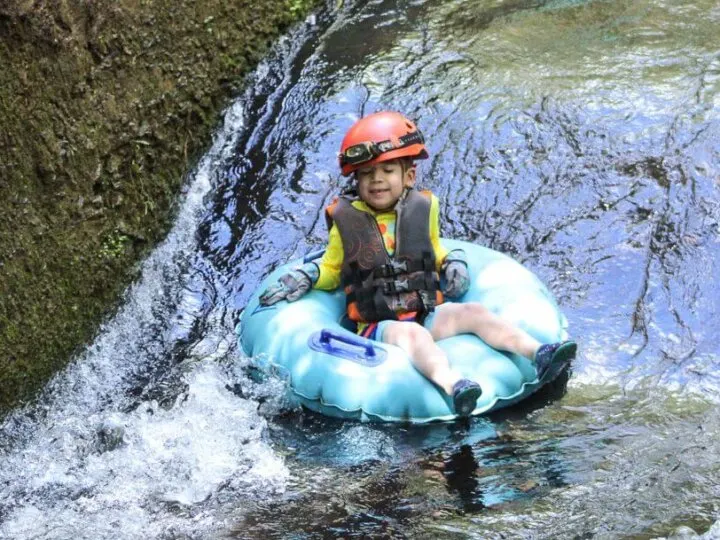 Kauai Backcountry Adventures feature's the only mountain tubing adventure on Kauai and it's a fun, kid-friendly Kauai adventure! #kauai #tubing #hawaii | Kauai Mountain Tubing in Sugar Cane Canals featured by top US travel blogger, Marcie in Mommyland