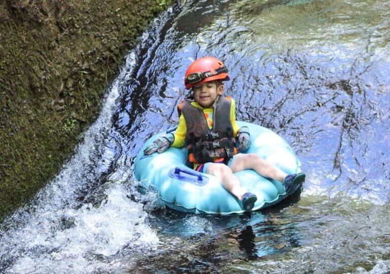 Kauai Backcountry Adventures feature's the only mountain tubing adventure on Kauai and it's a fun, kid-friendly Kauai adventure! #kauai #tubing #hawaii | Kauai Mountain Tubing in Sugar Cane Canals featured by top US travel blogger, Marcie in Mommyland