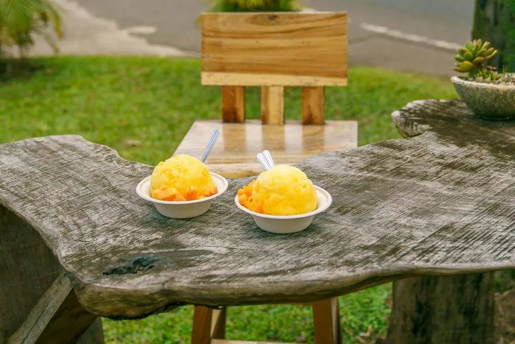 Wishing Well Shave Ice, in Hanalei, is one of the best shave ice spots on Kauai featuring organic syrups and fresh fruit. It's the final stop on the Tasting Kauai food tour of the North Shore. | The Tasting Kauai food tour is kid friendly and it's a fun thing to do on Kauai for families of all ages and abilities, featured by top US travel blogger, Marcie in Mommyland