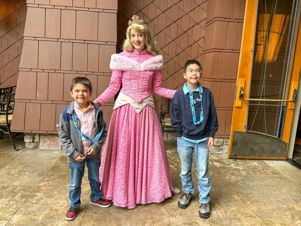 Image of Princess Aurora and two boys at the Disneyland Princess Breakfast.