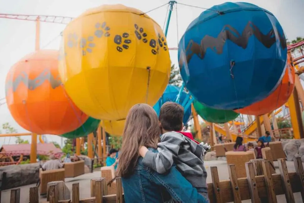Image of a mom and son in front of Balloon Races at Knott's Berry Farm