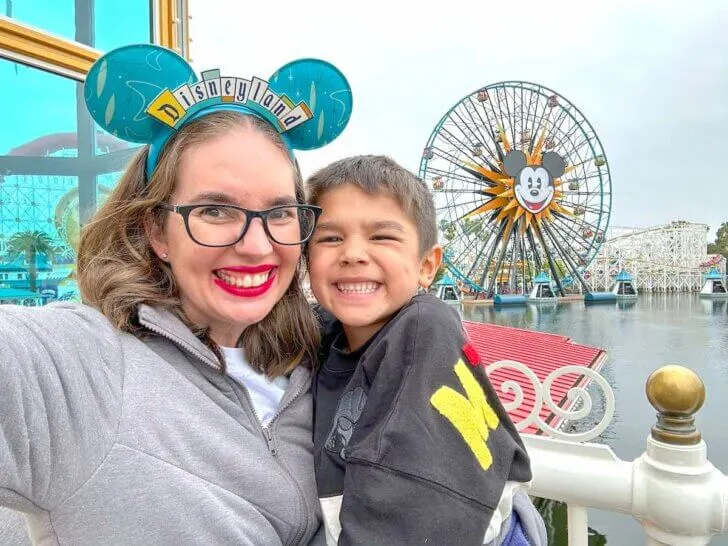 How many days to spend at Disneyland and Disney California Adventure for your next trip to Disneyland with kids, featured by top US Disney blogger, Marcie in Mommyland. Image of a mom and boy on Pixar Pier at Disneyland