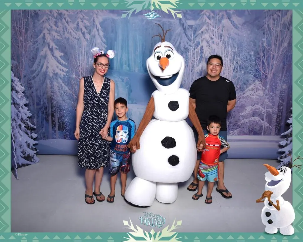 Image of a family meeting Olaf from Frozen on Disney Cruise Line