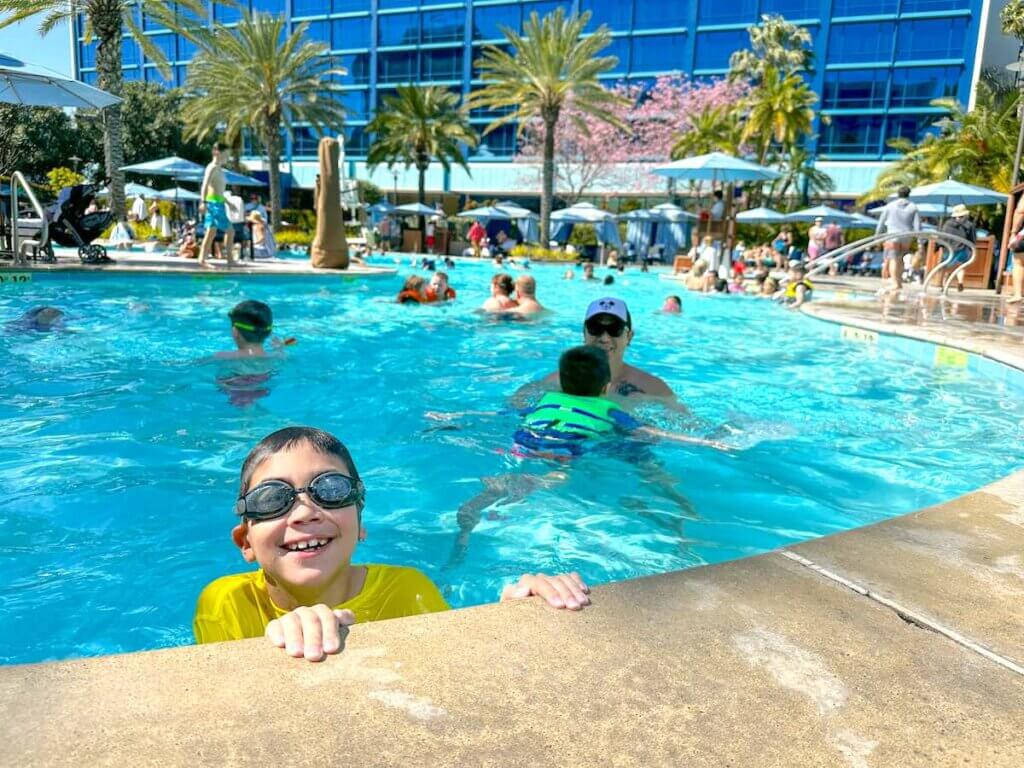 Image of a boy in a swimming pool at the Disneyland Hotel