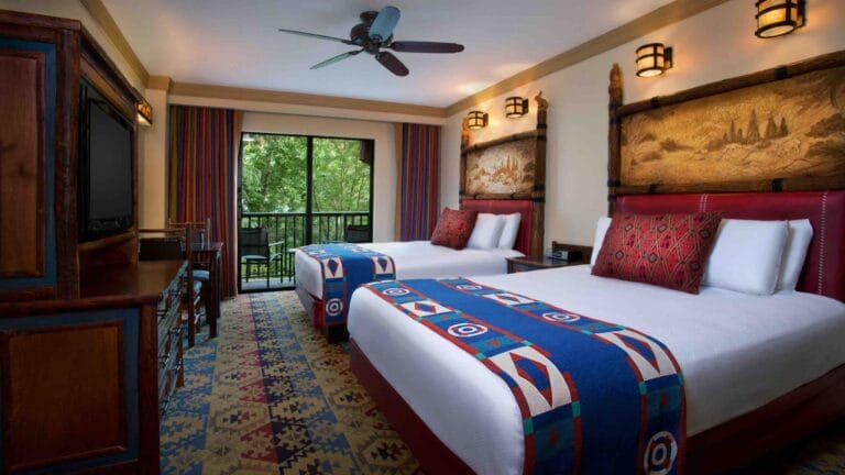 Walt Disney World Hotel for Every Budget featured by top US Disney blogger, Marcie and the Mouse: Inspired by turn-of-the-century national park lodges, Disney's Wilderness Lodge combines rustic charm with a contemporary flair on the shore of Bay Lake at Walt Disney World Resort. The 727-room hideaway features a spectacular six-story lobby, replete with teepee-topped chandeliers, totem poles, an 82-foot-tall stone fireplace and a bubbling hot spring that expands outside the building into a roaring waterfall. Walt Disney World Resort is located in Lake Buena Vista, Fla. (Disney)