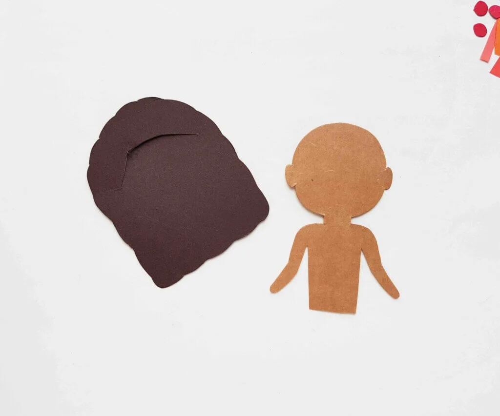 Image of a brown paper doll body and dark brown hair