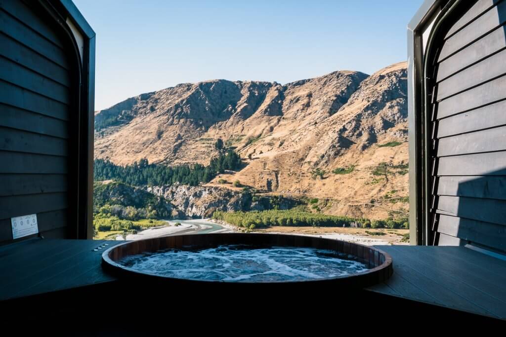 Top 12 Things to do in Queenstown with Kids featured by top family travel blogger, Marcie in Mommyland: Onsen Hot Pools is a fun thingto do in Queenstown with kids