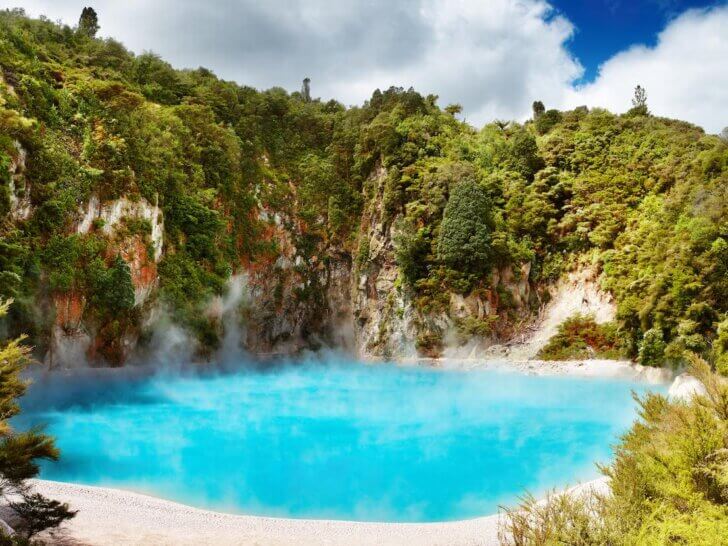 Find out all the cool things to do in Rotorua New Zealand. Image of Inferno Crater Lake in Waimangu volcanic valley, New Zealand