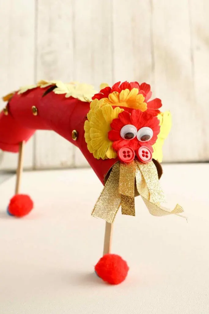 Learn how to make this Chinese New Year kids craft. Image of a cardboard tube Chinese Dragon puppet.