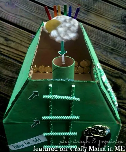 Creative leprechaun trap for kids using cardboard tubes, straws, and gold coins.