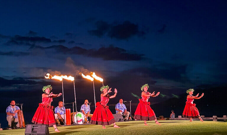 Find out the best luau on Maui according to top family travel blog Marcie in Mommyland. Image of hula dancers at the Feast at Mokapu.