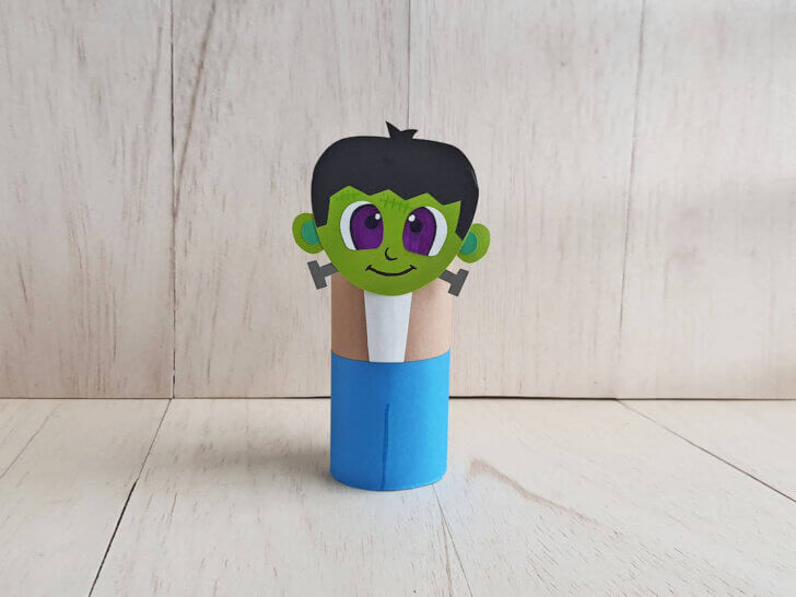 Learn how to make this cute Frankenstein toilet paper roll craft by top Seattle lifestyle blogger Marcie in Mommyland. Image of a Frankenstein Halloween paper craft for kids.