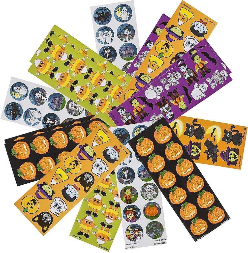These stickers are fun Halloween handout ideas that aren't candy. Image of a bunch of Halloween stickers.
