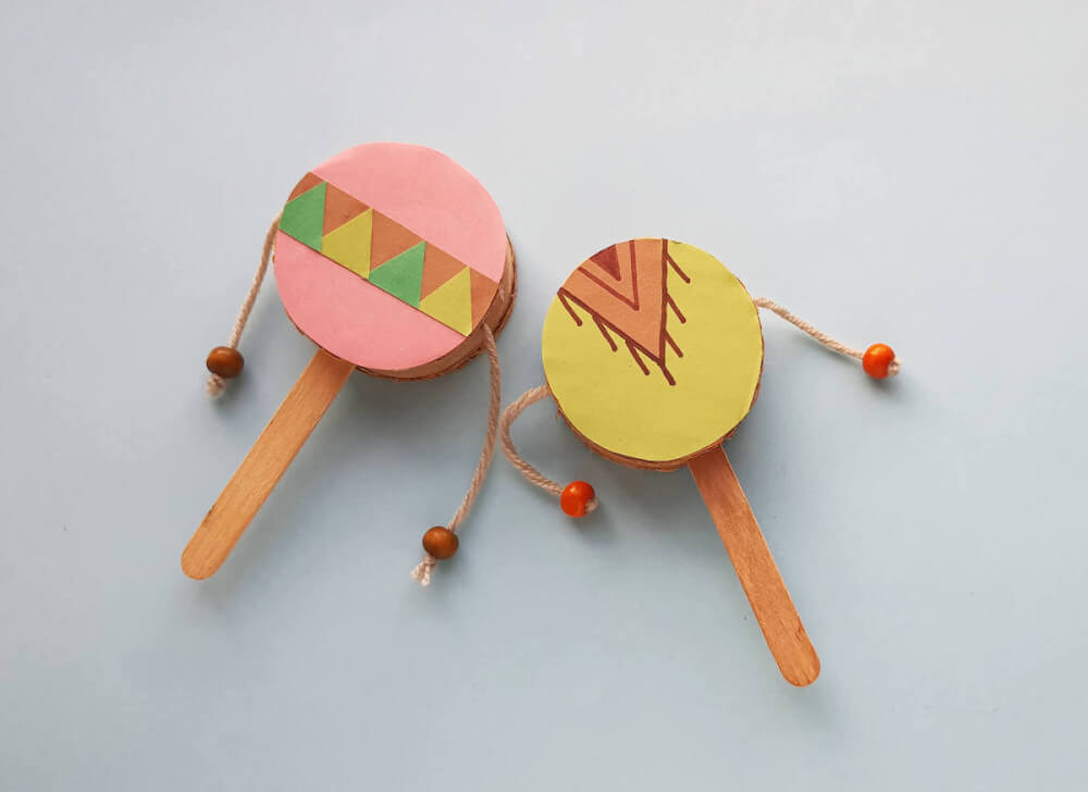 Find out how to make this Native American spin drum craft for kids by top Seattle blog Marcie in Mommyland. Image of a colorful Native American craft drum