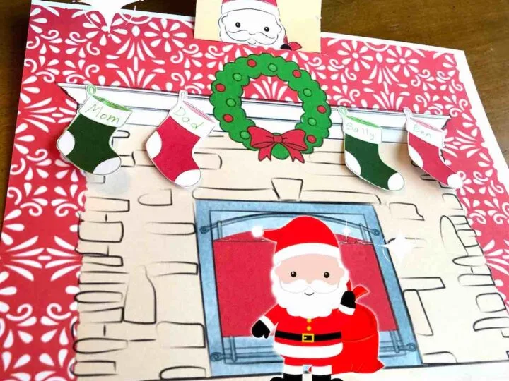 Learn how to make this printable Twas the Night Before Christmas craft by top Seattle blog Marcie in Mommyland. Image of Santa coming down the chimney