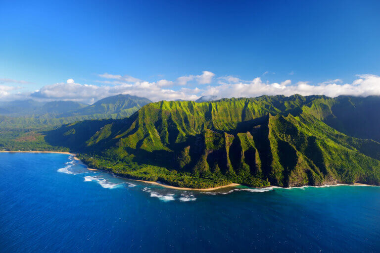 Get top tips for planning a Hawaii trip by a mom who's visited Hawaii more than 35 times! Image of the Na Pali Coast on Kauai.
