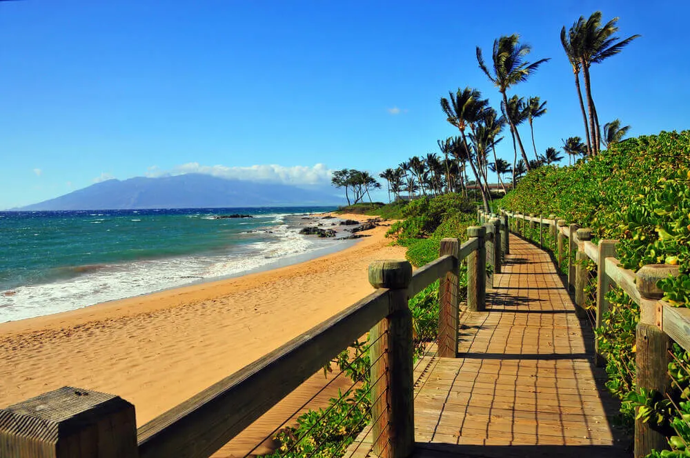 Image of a wooden plank pathway on a beach in Maui Hawaii.