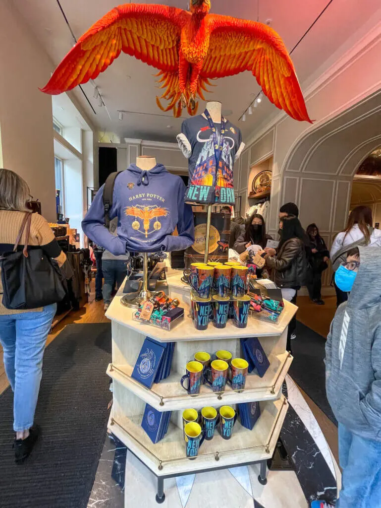 Image of a Harry Potter New York clothing display with a red Phoenix on top
