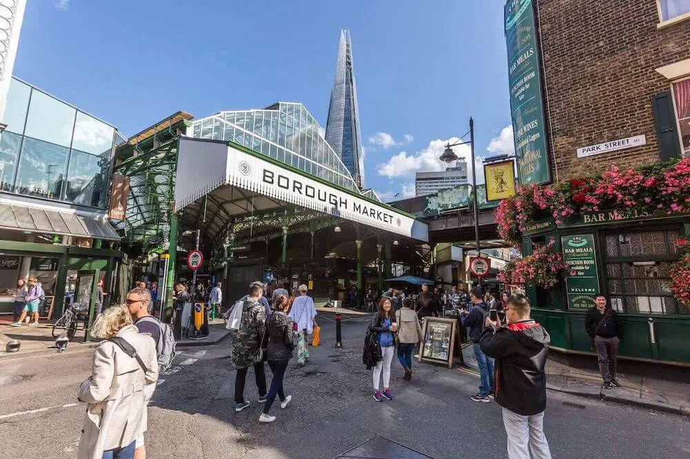 Image of people walking in front of the Borough Market entrance