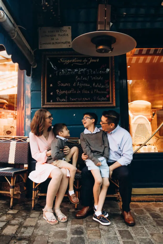 Image of a family sitting outside a restaurant in Montmartre Paris